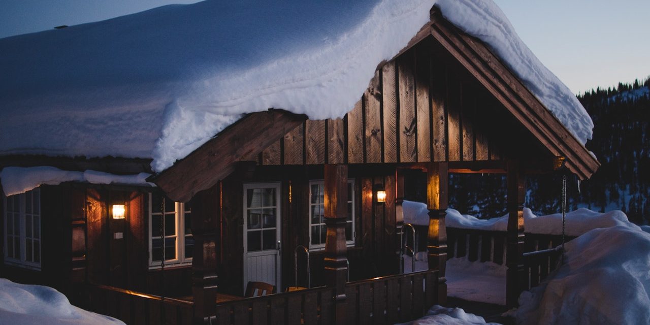 brown-wooden-house-during-snow-950058